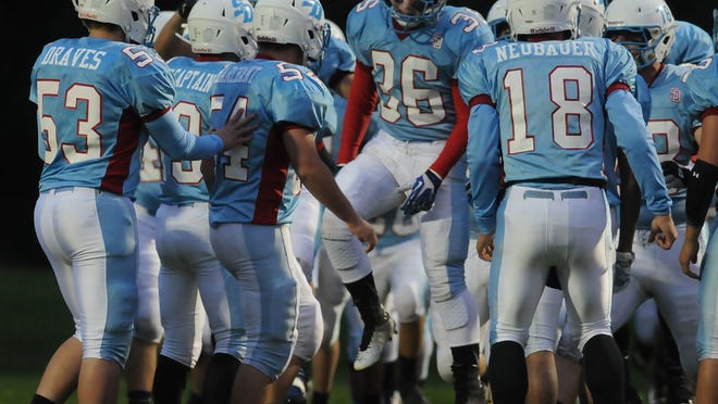 
Southern Door's Trenton Michaletz (36) helps rally the team prior to its game last Friday against Brillion. 
