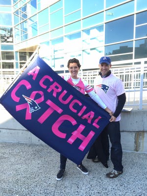 Loveland residents Beth and T.J. Steele at a New England Patriots game in October, 2014. They brought awareness to the NFL's Crucial Catch breast cancer screening and awareness campaign.