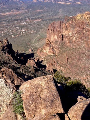 Views from the top of Flatiron in Arizona's Superstition Mountains. Flatiron reaches 4,861 feet in elevation and provides impressive views of Lost Dutchman State Park. The park, formerly managed by the Bureau of Land Management, was transferred to the state of Arizona through the Recreation and Public Purposes Act in 1972.