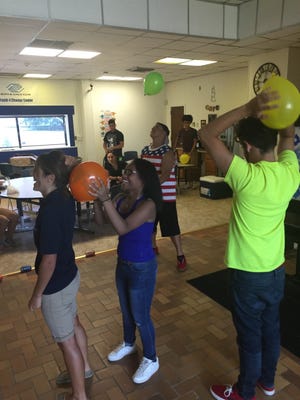 Teens from the Boys and Girls Club of Vineland's Youth for Change Center experimented with static electricity as part of the Summer Brain Gain program.