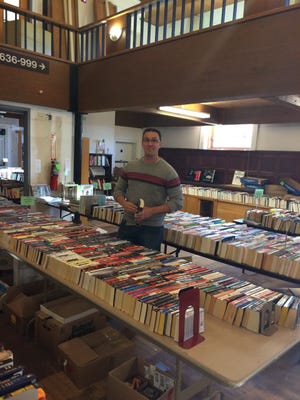 Oakland library director Peter Havel surveys used books stored in the original 1937 structure, which is scheduled for renovations