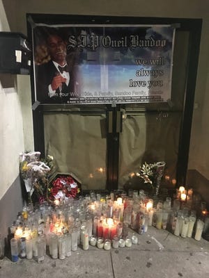The silent protest started outside The Mansion nightclub, where club owner O'Neil Bandoo was shot to death Christmas morning.