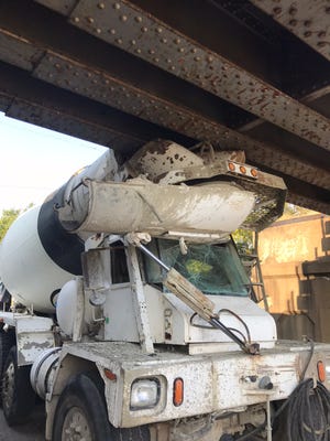 A concrete mixer truck hit a CSX overpass on North Ingram Street Wednesday morning.