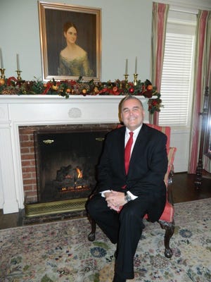 Bill Seklar, President and CEO of The Community House, sits in the Ginger Meyer room of TCH. This room is popular with brides as they get ready for their weddings. It has an inviting fireplace.