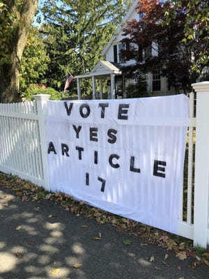 A banner supporting Article 17 outside a home in Needham.