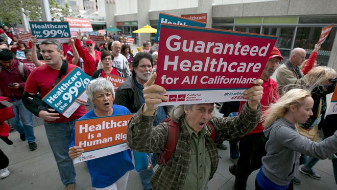 Supporters of single-payer health care march to the Capitol on April 26, 2017.