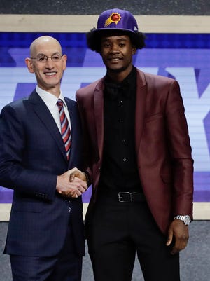 Kansas' Josh Jackson, right, poses for a photo with NBA Commissioner Adam Silver after being selected by the Phoenix Suns as the fourth pick overall during the NBA basketball draft, Thursday, June 22, 2017, in New York.