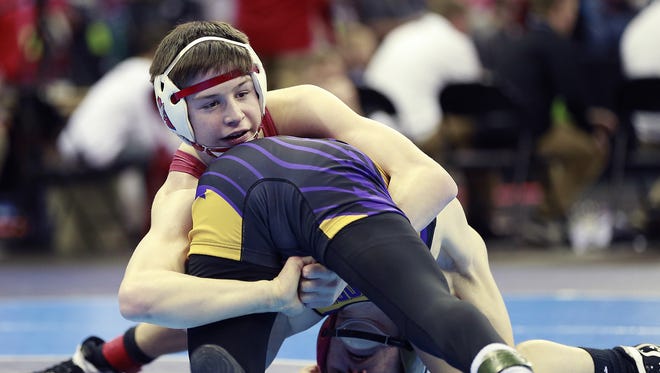 Arrowhead's Keegan O'Toole wraps up Elkhorn's Daniel Stilling during their 132-pound  Division 1 semifinal Friday.