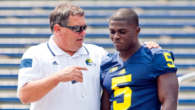 Brady Hoke, left, speaks with Jabrill Peppers on Aug. 10, 2014.