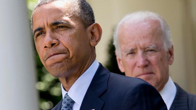President Barack Obama, accompanied by Vice President Joe Biden, pauses while making an announcement about immigration reform, on Monday, June 30, 2014, in the Rose Garden of the White House in Washington.