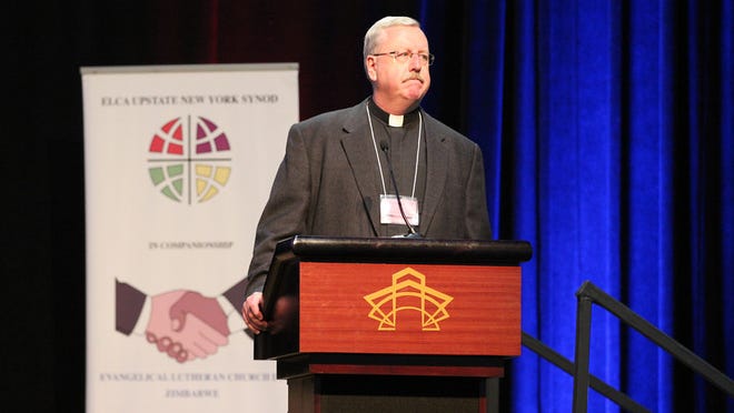 
Bishop-elect the Rev. John Macholz, pastor of Atonement Lutheran Church in Brighton, speaks at the 2014 ELCA Upstate New York Synod Assembly in Rochester. 
