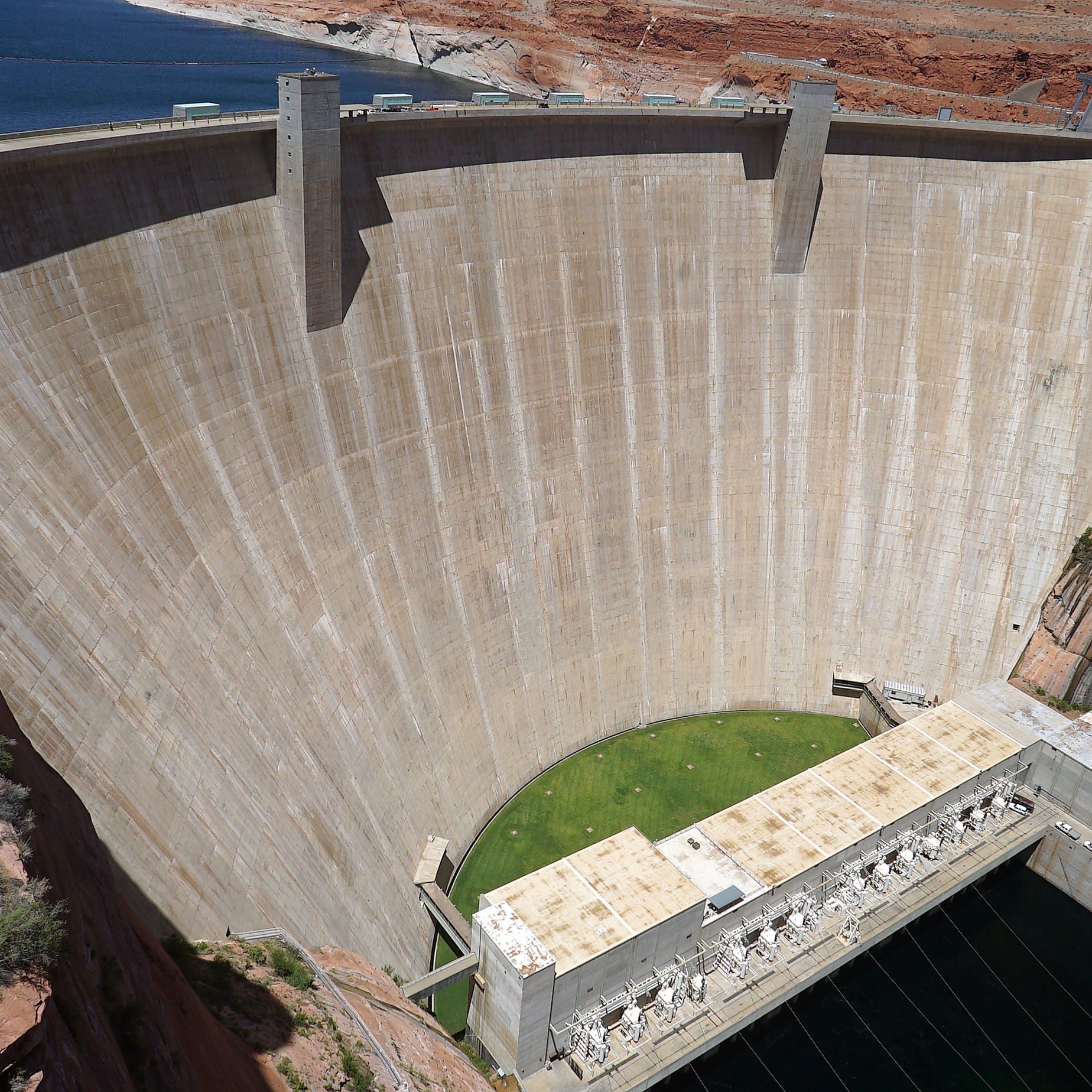The Glen Canyon Dam, which impounds the Colorado River to create Lake Powell, was originally designed to be 16 feet higher, making it the same height at the Hoover Dam on Lake Meade in Nevada. Engineers shortened the dam, lowering the reservoir's height, to protect Rainbow Bridge, North America's largest natural rock bridge, which is about 50 miles north of the dam.      