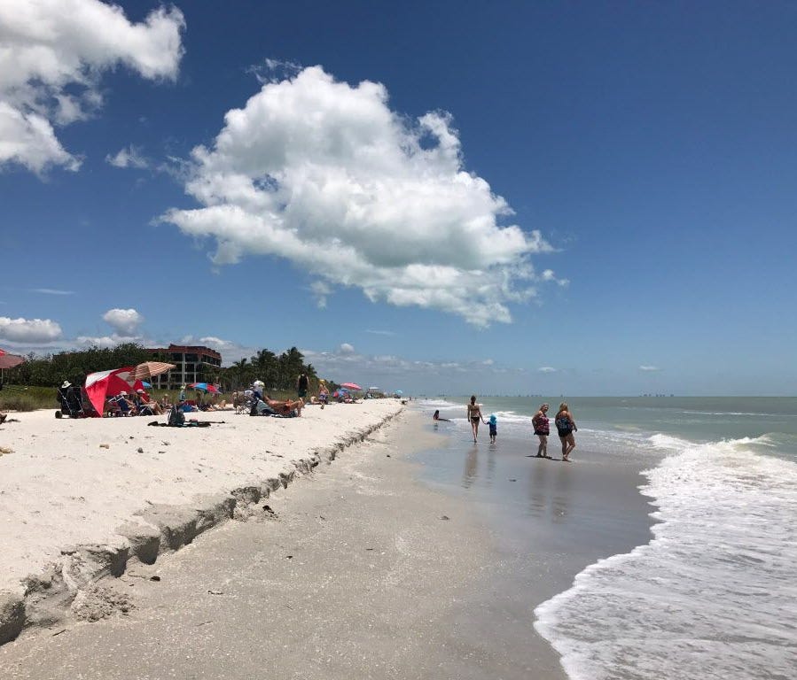 Tourists enjoy Sanibel beach west of Florida on April 25, 2017.