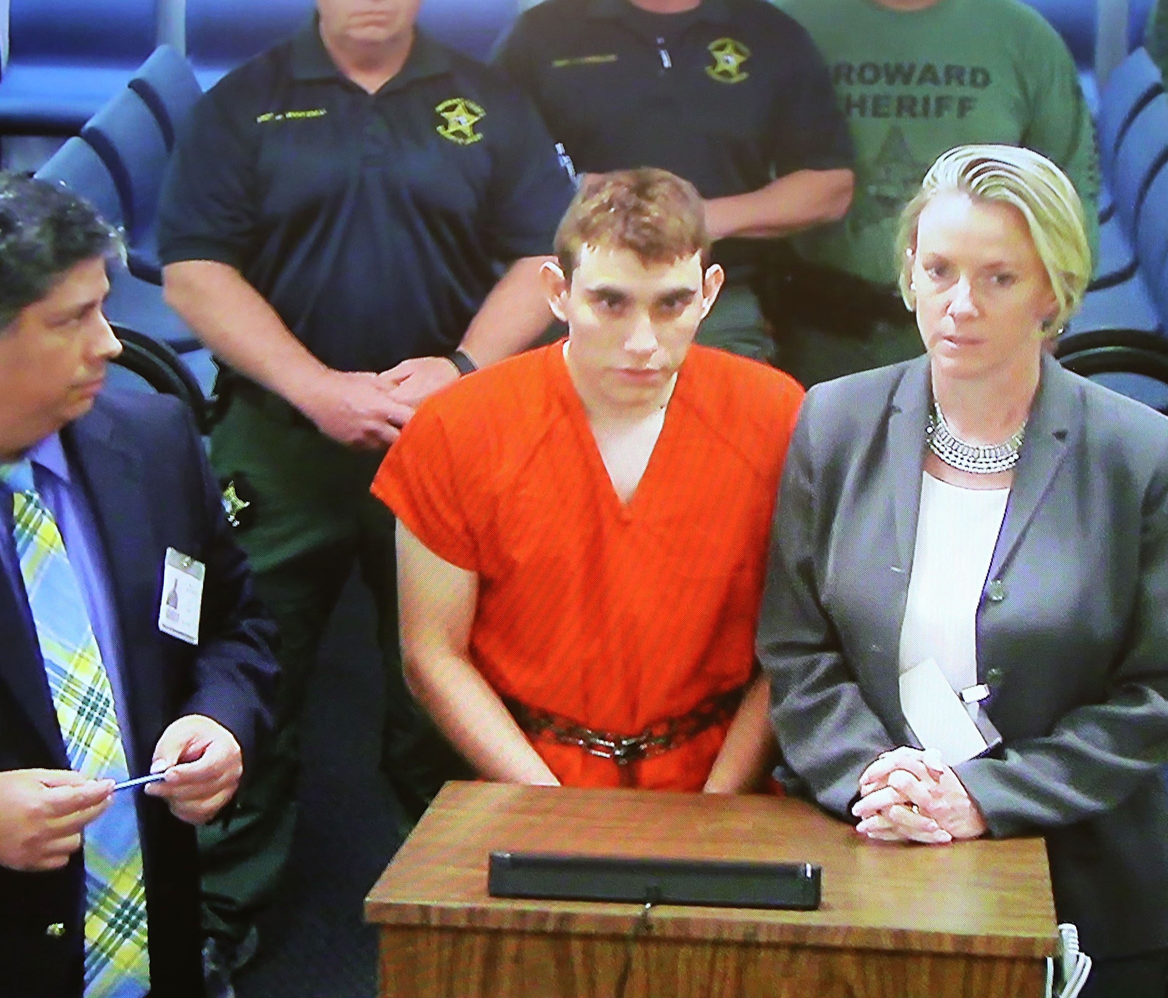Nikolas Cruz, 19, a former student at Marjory Stoneman Douglas High School in Parkland, Fla., where he allegedly killed 17 people, is seen on a closed circuit television screen during a bond  hearing in front of Broward Judge Kim Mollica at the Browa