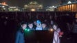 People look at a noticeboard after a fireworks display