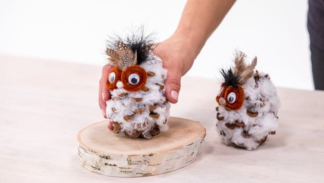 DIY pinecone owl holiday craft.