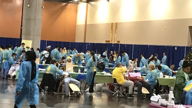 Thousands lined up at the Phoenix Convention Center in downtown Phoenix to receive free medical and dental care on Dec. 25, 2017.