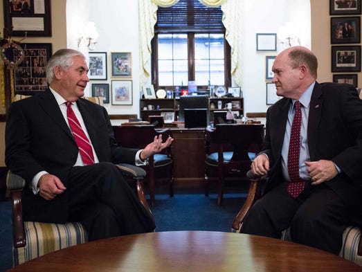Sen. Chris Coons, D-Del., talks with Tillerson before