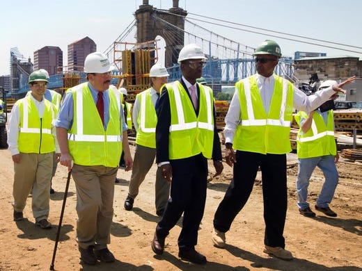 Mayor Mark Mallory, center, and Commissioner Todd Portune, left, tour The Banks construction site on the Cincinnati riverfront on May 15, 2009. The Mayor and Commissioner are led by Tom Bell, Project Executive for Messer Constructionm right. The Enquirer/Malinda Hartong