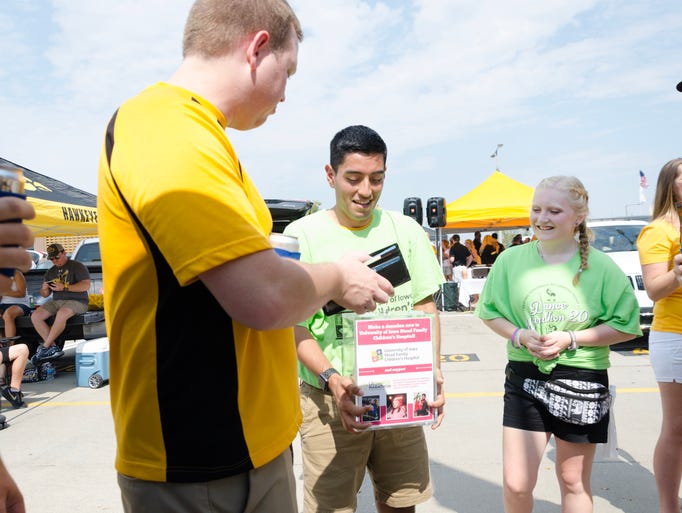 University of Iowa students Marco Cuellar (20) and