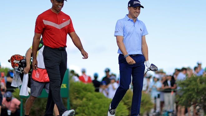 NASSAU, BAHAMAS - DECEMBER 07: Tiger Woods and Justin Thomas of the United States walk off the first hole during the final round of the Hero World Challenge at Albany on December 07, 2019 in Nassau, Bahamas. (Photo by Mike Ehrmann/Getty Images)