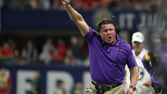 Dec 7, 2019; Atlanta, GA, USA; LSU Tigers head coach Ed Orgeron reacts after a catch by wide receiver Terrace Marshall Jr. (not pictured) in the first quarter against the Georgia Bulldogs in the 2019 SEC Championship Game at Mercedes-Benz Stadium. Mandatory Credit: Jason Getz-USA TODAY Sports