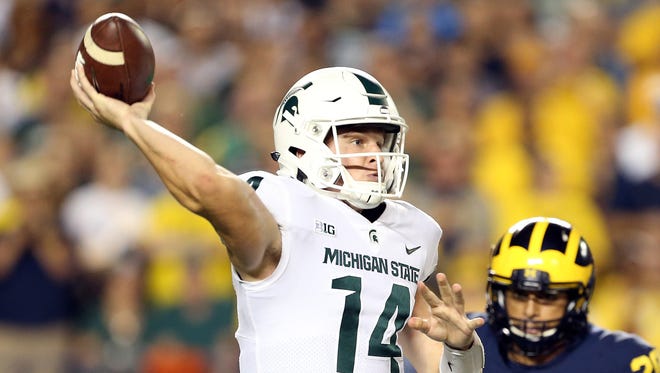 Michigan State quarterback Brian Lewerke attempts to throw the ball against Michigan during the first half at Michigan Stadium on Oct. 7, 2017 in Ann Arbor.