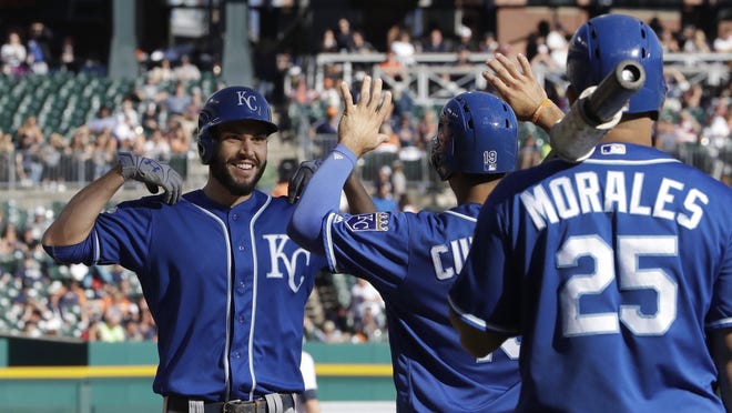The Kansas City Royals' Eric Hosmer, left, is greeted at home after his three-run home run in the ninth inning Saturday against the Detroit Tigers.