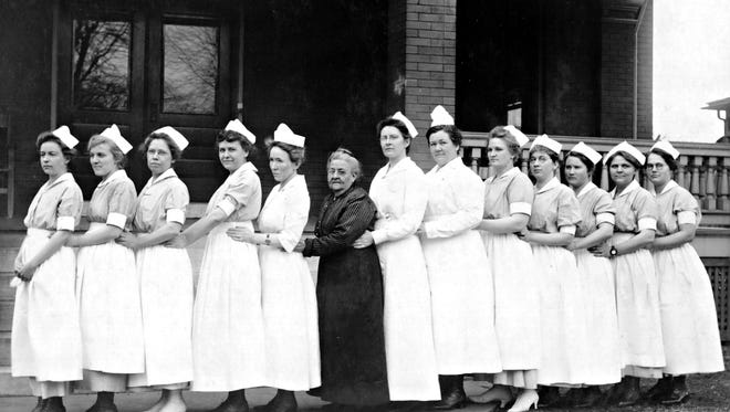 Ellen Burge, who donated her duplex to begin the hospital in 1906, is shown with nurses in front of one of CoxHealth’s early facilities.