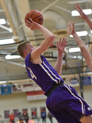 Zach Harp is fouled as he goes up for a shot against Hamilton.