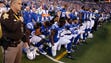 Colts players kneel during the anthem in Week 3.