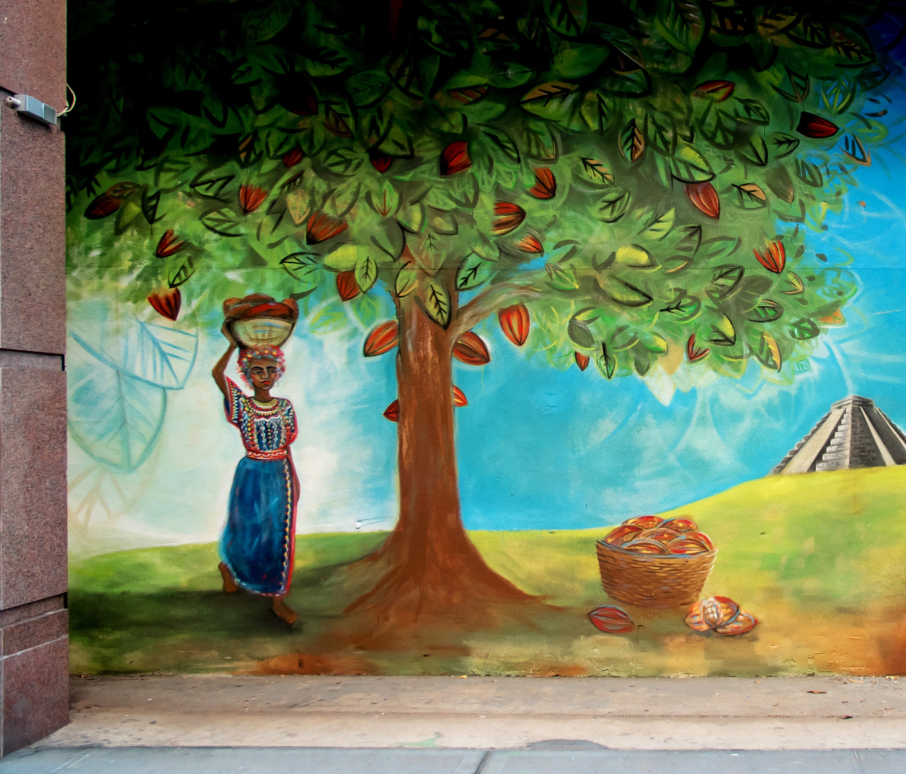 A Brooklyn artist painted a mural inspired by a Yucatan cacao plantation at the entrance of Choco-Story New York.