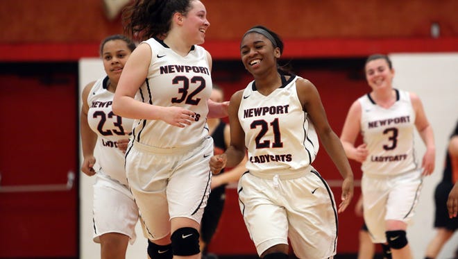 Newport Ladycats [L-R] Kylie Orr, Kelis McGuire, Morgan McDay and Star Yeager celebrate as they run back down the court.