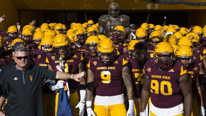 Arizona State head caoch Todd Graham leads his team onto the field against Arizona in the first half on Nov. 25, 2017 during the 91st Annual Territorial Cup in Tempe, Ariz.