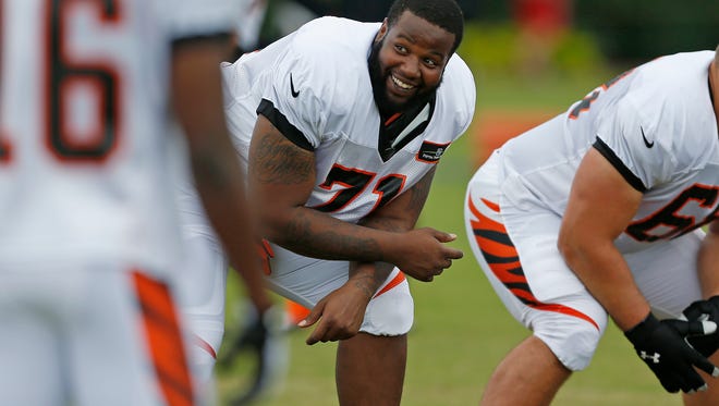 Bengals offensive tackle Andre Smith smiles during practice on July 27.