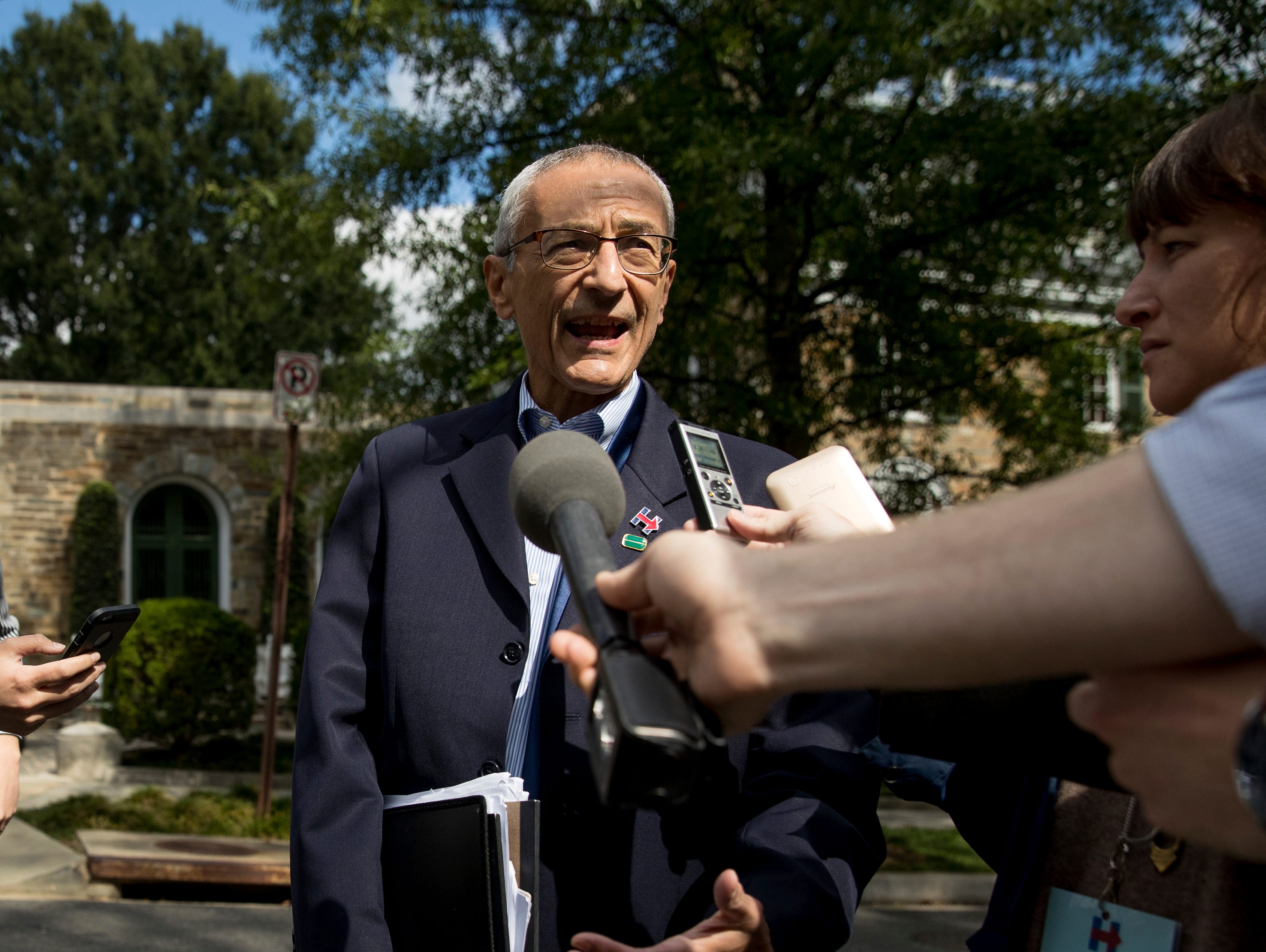 Hillary Clinton's campaign chairman, John Podesta, speaks to reporters in Washington in October.