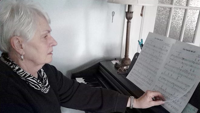 Singer Jeanette Beck at the piano in her Lebanon home in December 2015.