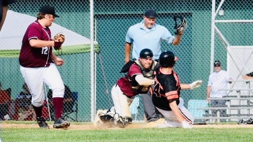 Brandon Grund holds ground for the Kilowatts diligently defending home plate.