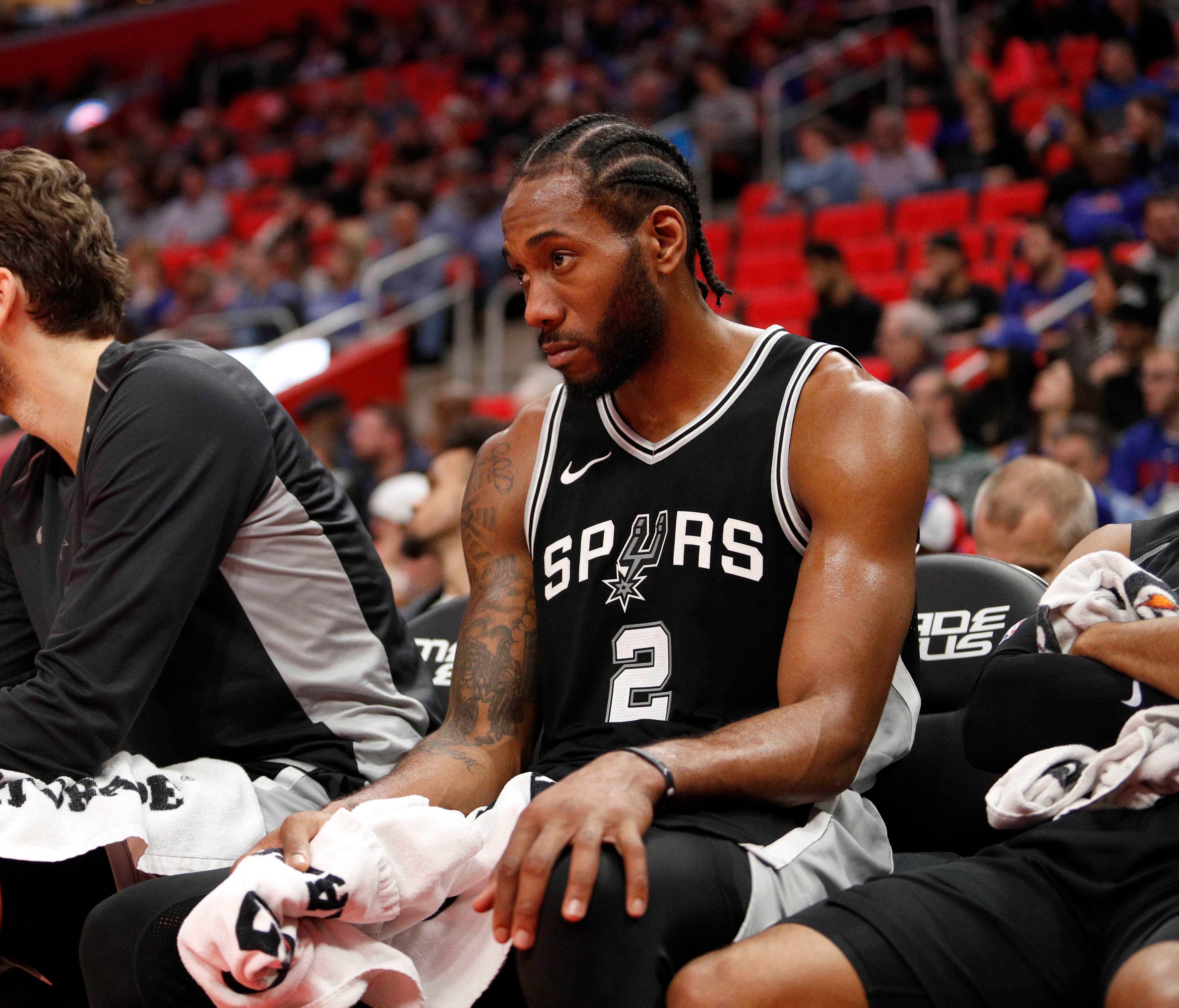 San Antonio Spurs forward Kawhi Leonard (2) sits on the bench during the fourth quarter against the Detroit Pistons at Little Caesars Arena.