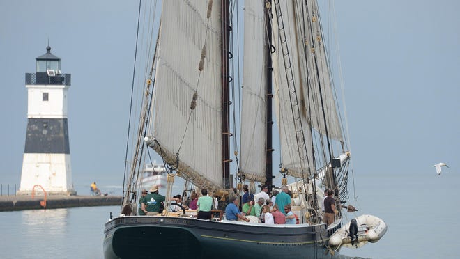 The historic tall ship schooner Lettie G. Howard passes the North Pier Light in Presque Isle State Park. The flagship Niagara League announced on Wednesday the cancellation of the sailing season for the Lettie G. Howard.