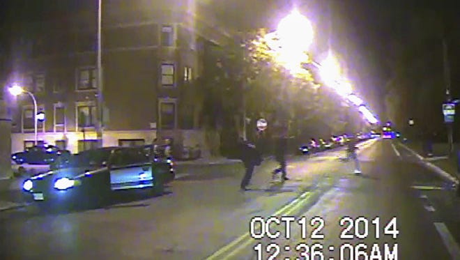 Chicago Police handout/Epa
A Chicago police dash camera shows Ronald Johnson, right, carrying a pistol in an October 2014 pursuit. Officer George Hernandez was cleared of wrongdoing in Johnson?s shooting death.
epa05058821 A frame grab from a Chicago Police Department dash camera video and made available by the State's Attorney's office on 07 December 2015 reportedly shows 25 year old Ronald Johnson (R) carrying a loaded pistol as he is pursued by Chicago police officers in Chicago, Illinois, USA, on 12 October 2014. Officer George Hernandez has been cleared of wrongdoing in the shooting death of Johnson which occurred a few days before the police shooting of 17 year old Laquan McDonald by Officer Jason Van Dyke. Van Dyke has been charged with murder in that incident. The US Justice Department has announced an investigation into the practices of the police department.  EPA/CHICAGO POLICE DEPARTMENT / HANDOUT EDITORIAL USE ONLY / NO SALES /BEST QUALITY AVAILABLE ORG XMIT: THM02