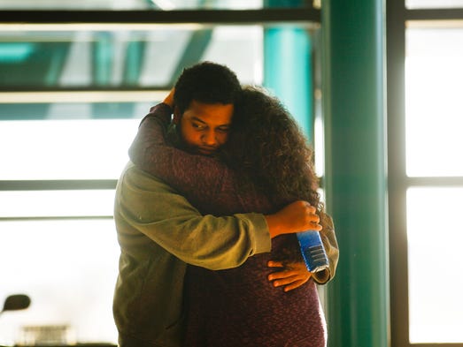 Aztec High School junior Canisius Phillips is reunited