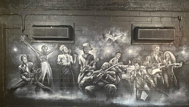 Rolling Rooster owner Glenn Williams commissioned Austin artist Chris Rogers to create a mural at the restaurant's Victory Grill location celebrating the history of Black music. The mural features Austin musician Gary Clark Jr. (fourth from left).