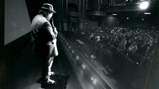 Filmmaker Michael Moore addresses his audience before a January 1990 screening of his documentary “Roger & Me” at the Detroit Institute of Arts.