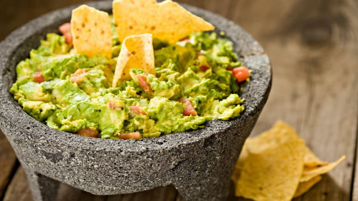 Credit:                      Getty Images / DebbiSmirnoff                                             Making guacamole with a molcajete releases flavor compounds for a better dip.