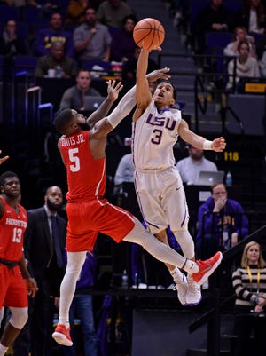 LSU guard Tremont Waters (3) blocks the shot of Houston guard Corey Davis Jr. (5) during an NCAA college basketball game, Wednesday, Dec. 13, 2017, at LSU's Pete Maravich Assembly Center in Baton Rouge, La. (Hilary Scheinuk/The Advocate via AP)