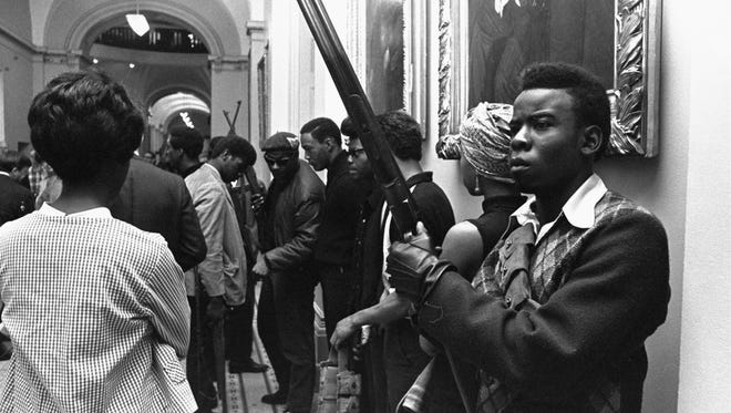 Armed members of the Black Panther Party stand in the corridor of the Capitol in Sacramento, Calif., on May 2, 1967. They were protesting a bill before a state assembly committee restricting the carrying of arms in public.