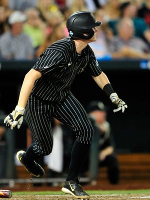 Vanderbilt's Will Toffey watches his two-run double against Virginia during the sixth inning in the College World Series on Monday at TD Ameritrade Park in Omaha, Neb. The win gave the Commodores a lead they would never relinquish.