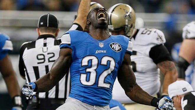 Detroit Lions' James Ihedigbo celebrates after a sack of New Orleans Saints quarterback Drew Brees in the first half in Detroit on Sunday, October 19, 2014.