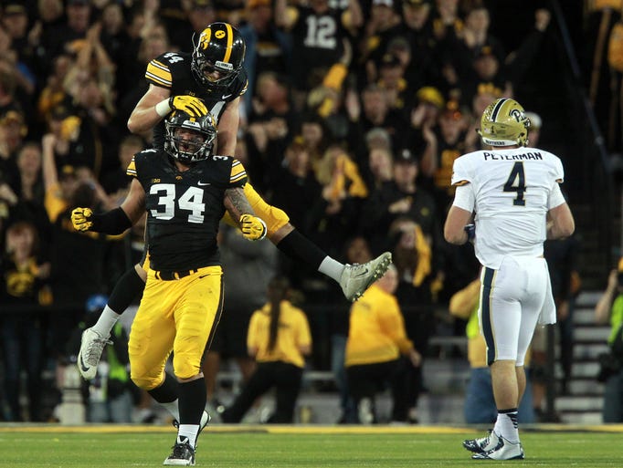 Iowa's Ben Niemann congratulates Nate Meier for his